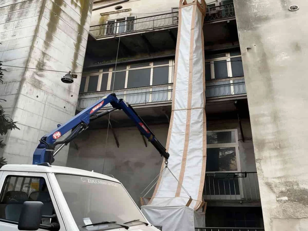 Two lengths of PP rubble chute joined end to end so the run covers the full drop height