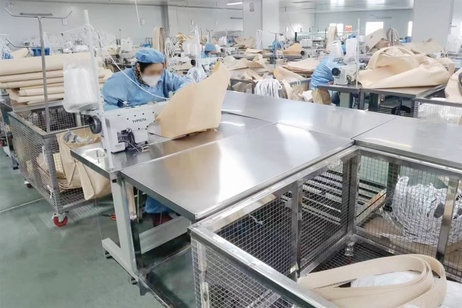 Sewing workers producing FIBC bulk bags on the manufacturing line